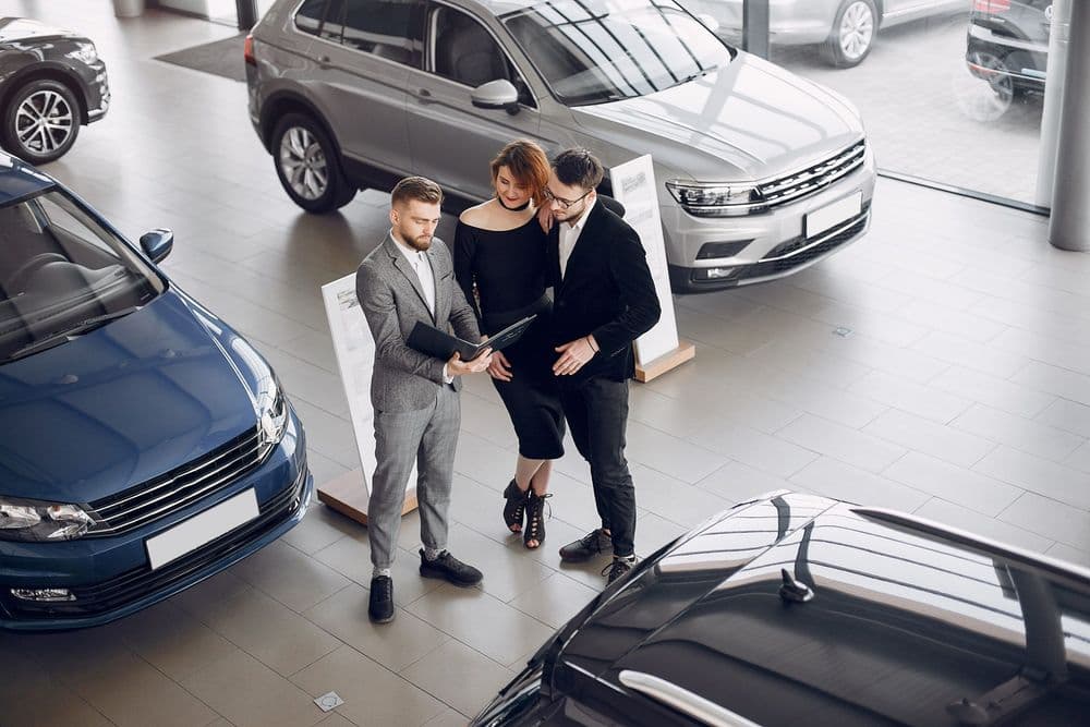 stylish-elegant-couple-car-salon-scaled.jpg
